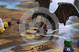 Playing Legends of Andor board game dices, figures and tiles, map photo